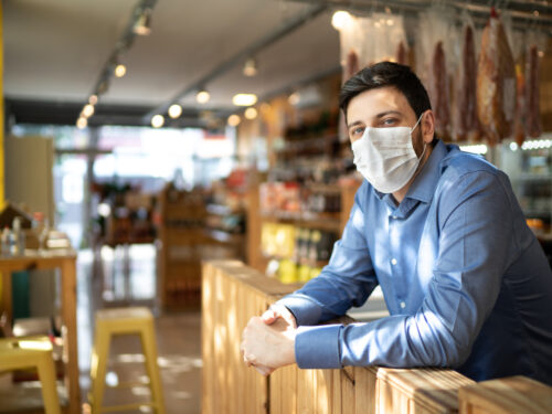 Portrait of small business man owner with face mask